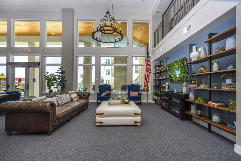 Modern clubhouse and lobby with sleek design at Sage Stone Oak Apartments, perfect for social gatherings and community events