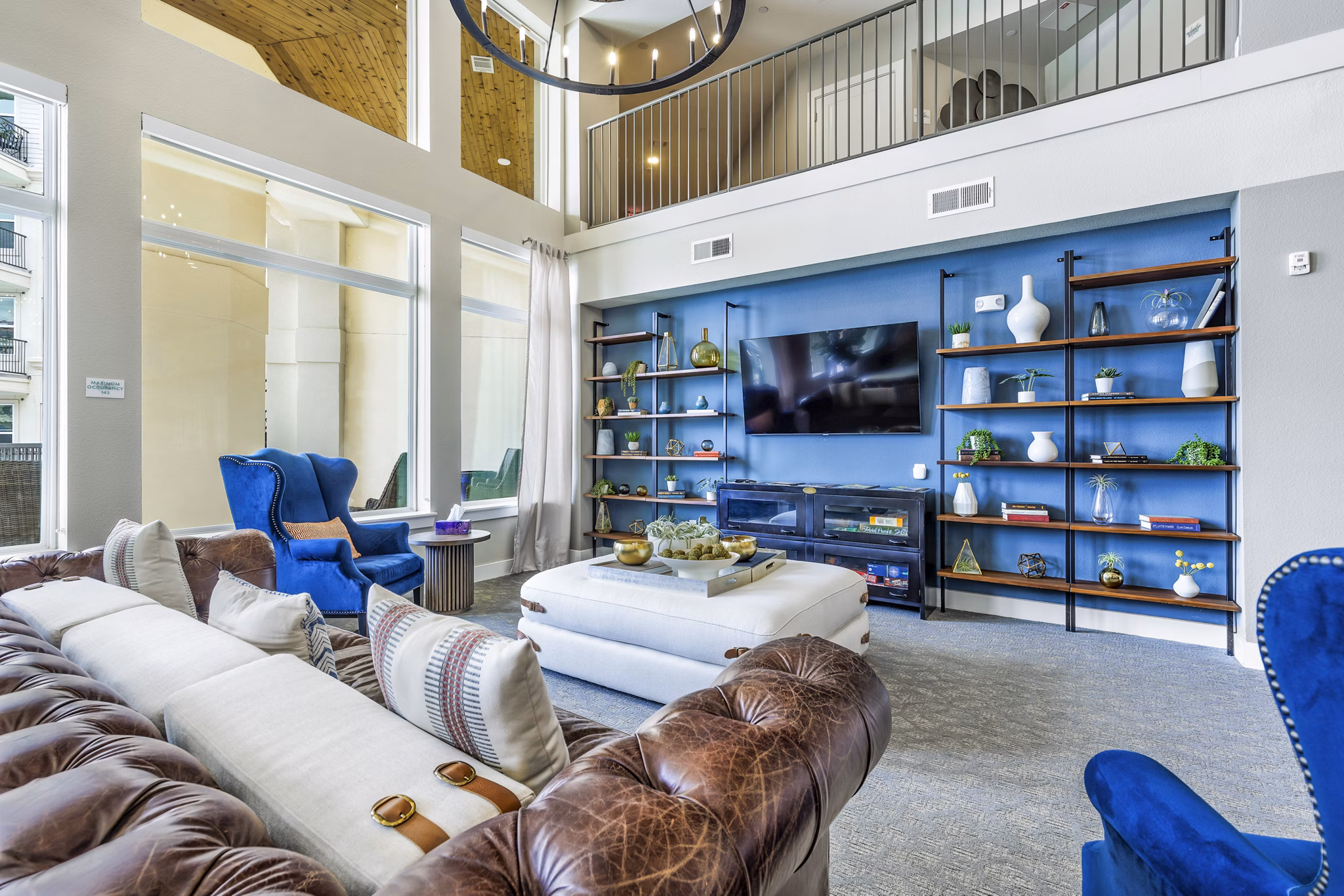 Modern clubhouse and lobby with sleek design at Sage Stone Oak Apartments, perfect for social gatherings and community events