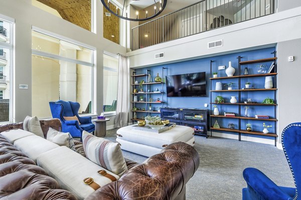 Modern clubhouse and lobby with sleek design at Sage Stone Oak Apartments, perfect for social gatherings and community events