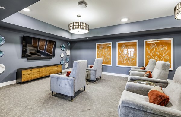 Sage Stone Oak Apartments: Modern clubhouse theater with plush seating