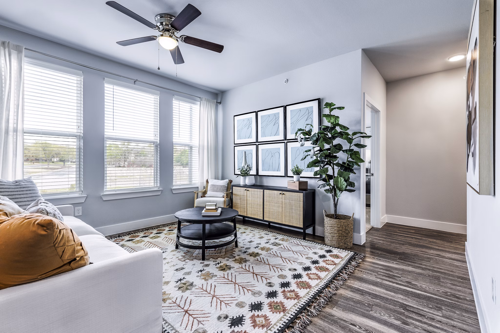 Spacious, modern living room with elegant furnishings at Sage Stone Oak Apartments, showcasing luxury urban living