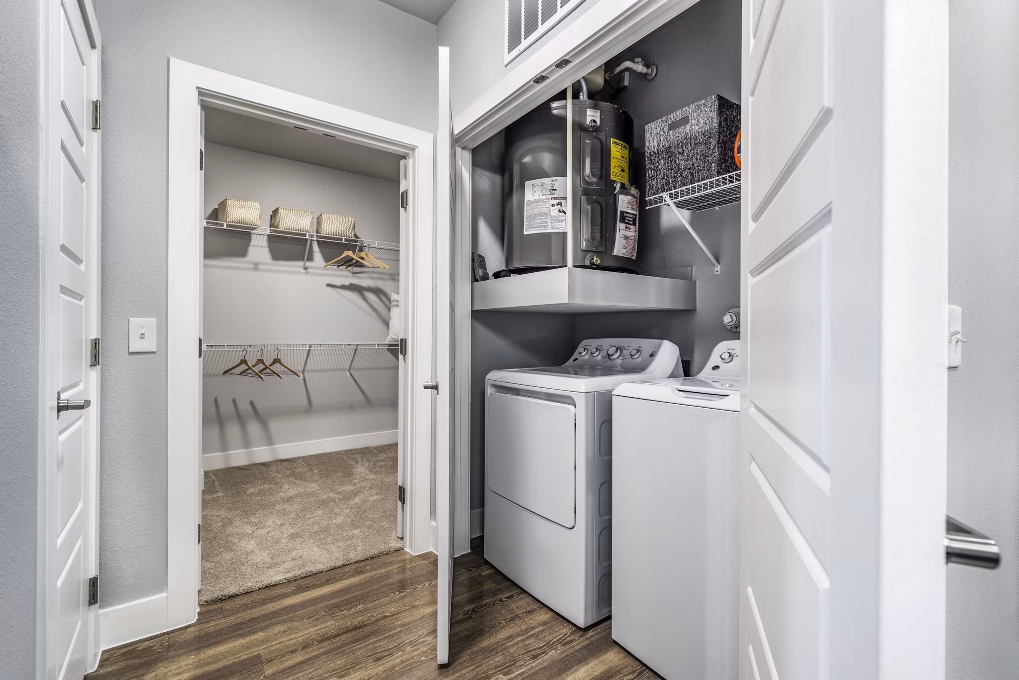 Modern laundry room with stainless steel appliances at Sage Stone Oak Apartments in San Antonio