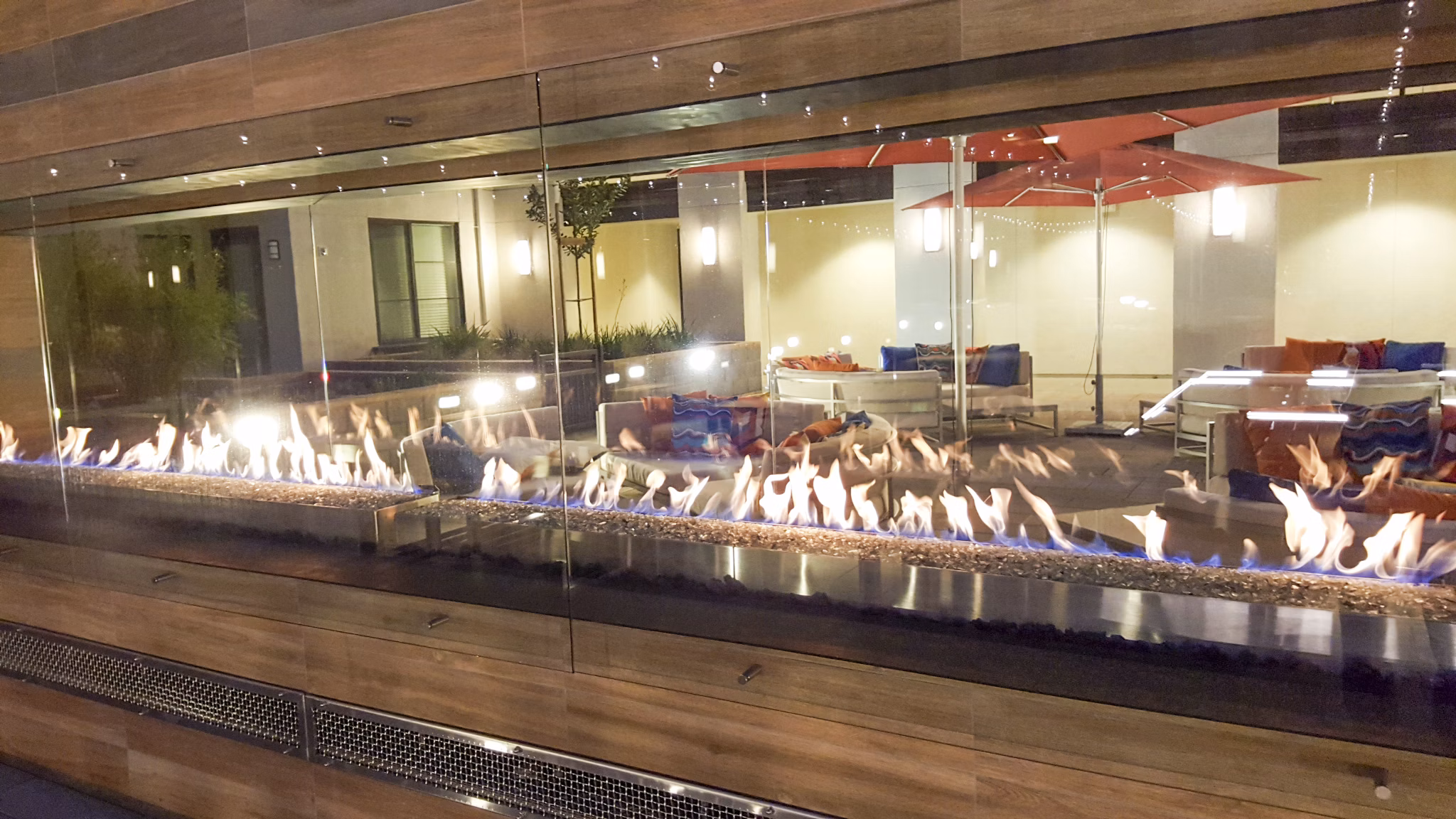 Fire pit on modern patio at mResidences Mountain View Apartments, offering a cozy outdoor gathering space with scenic views