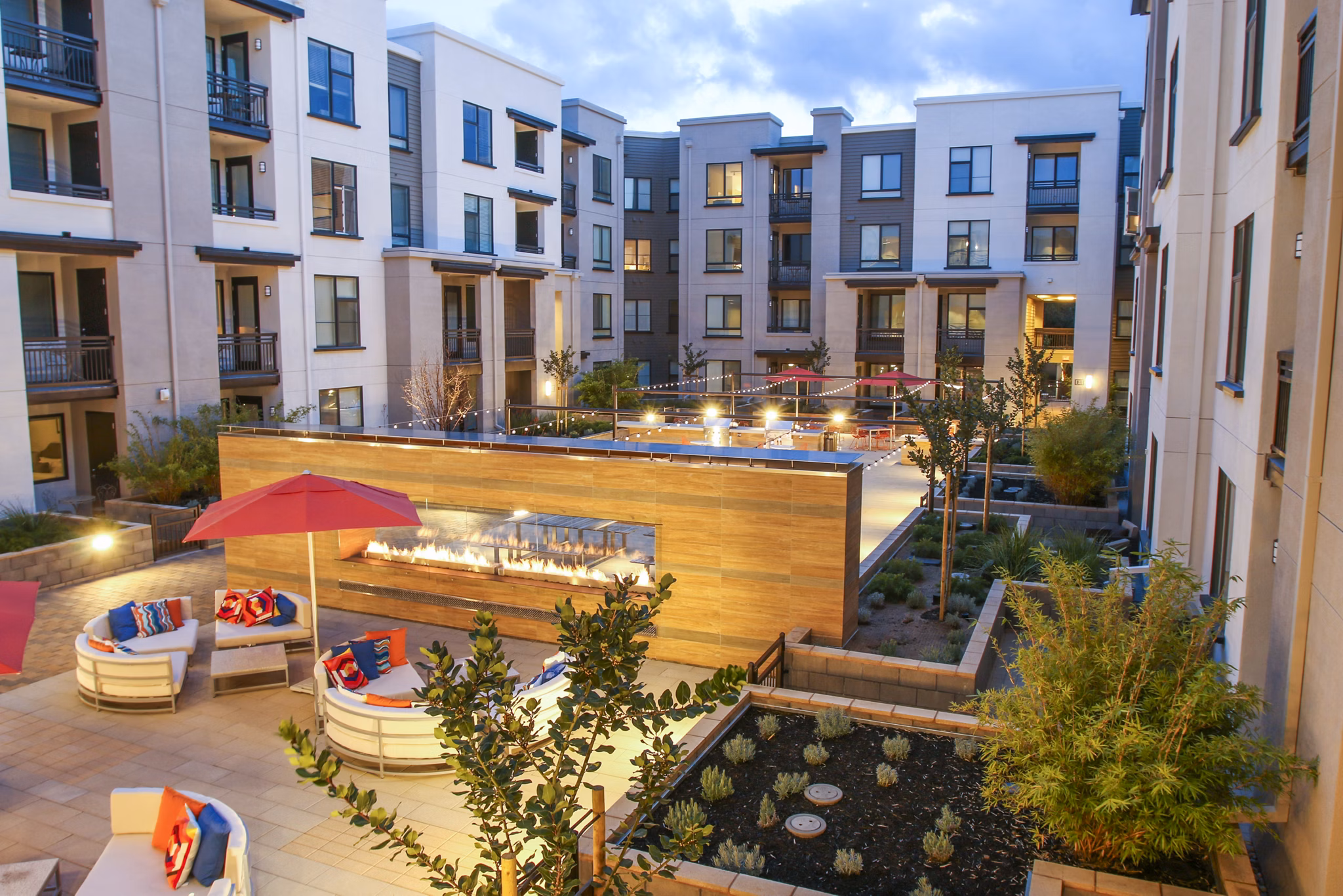 Fire pit and grill patio area at mResidences Mountain View Apartments, perfect for outdoor gatherings and relaxation
