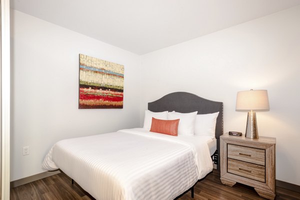 Cozy bedroom with luxurious bedding in mResidences South Lake Union Apartments