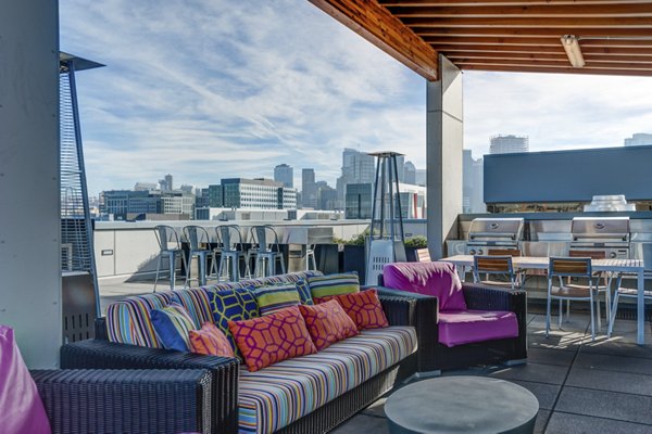 Courtyard with modern seating and lush greenery at mResidences South Lake Union Apartments