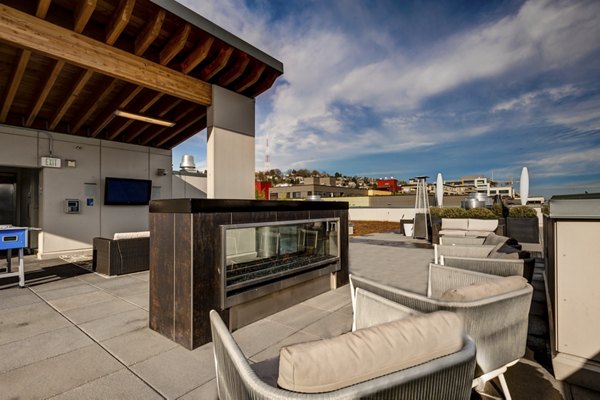 Relaxing outdoor seating with fire pit at mResidences South Lake Union Apartments â€“ perfect for gathering and socializing under the stars