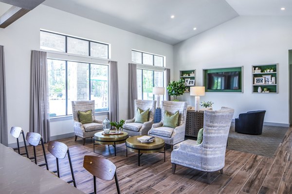 Modern living room with stylish furniture and decorative accents in luxury apartments