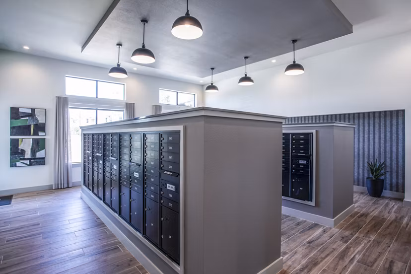 Mailroom featuring organized mailboxes and bright overhead lighting in luxury apartments