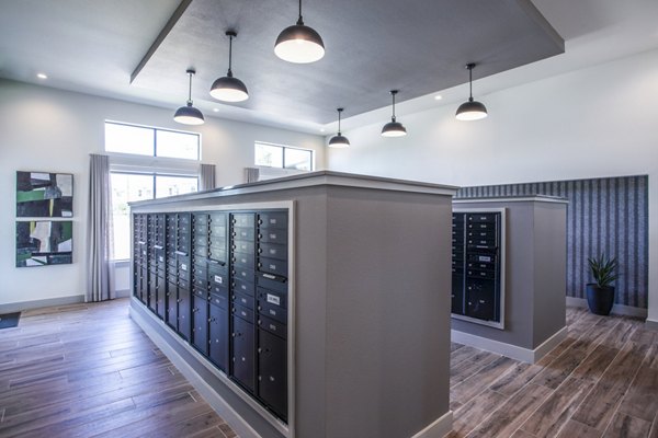 Mailroom featuring organized mailboxes and bright overhead lighting in luxury apartments
