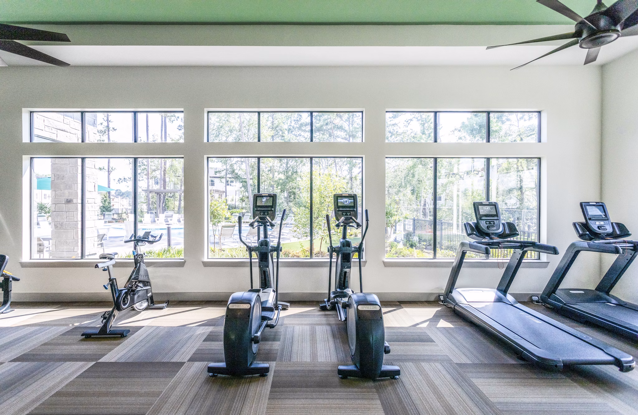 Fitness center featuring modern exercise equipment at luxury apartments