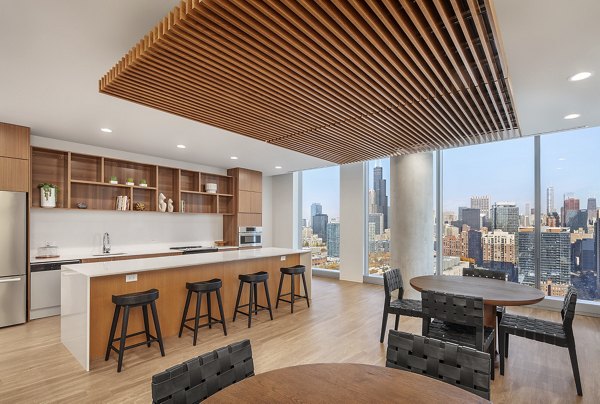 Clubhouse featuring modern furnishings and vibrant dÃ©cor at 1400 Wabash Apartments, offering a luxurious community space for residents