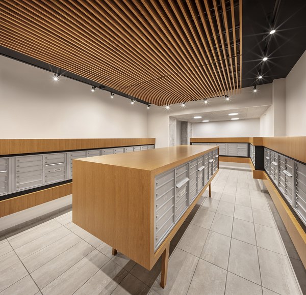Mail room with secure package lockers at 1400 Wabash Apartments