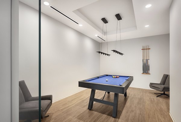 Game room featuring pool table and lounge area at 1400 Wabash Apartments
