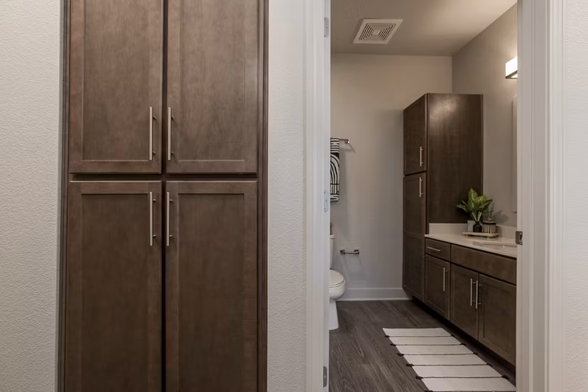 Contemporary hallway with elegant lighting and modern decor at The Avante Apartments