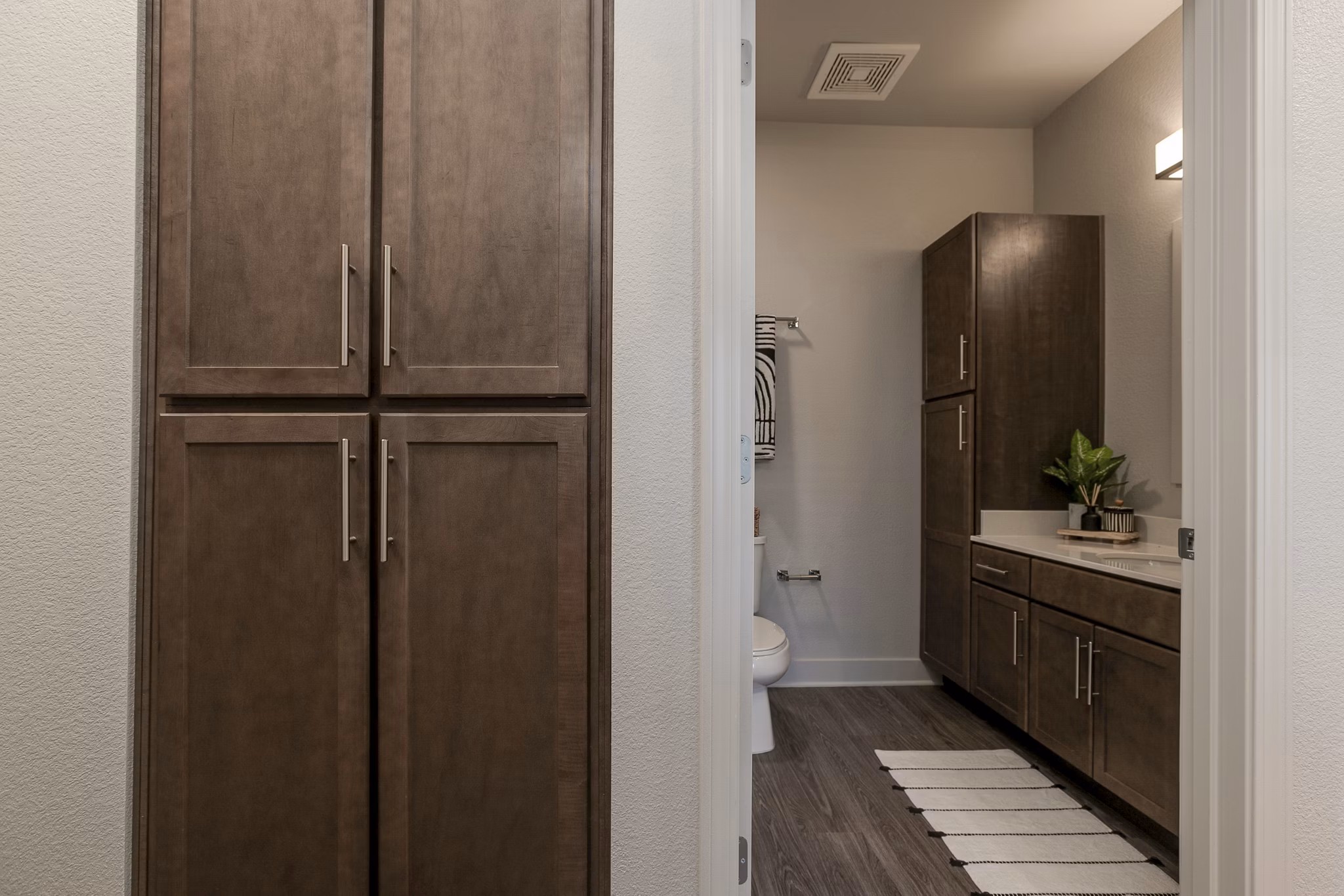 Contemporary hallway with elegant lighting and modern decor at The Avante Apartments