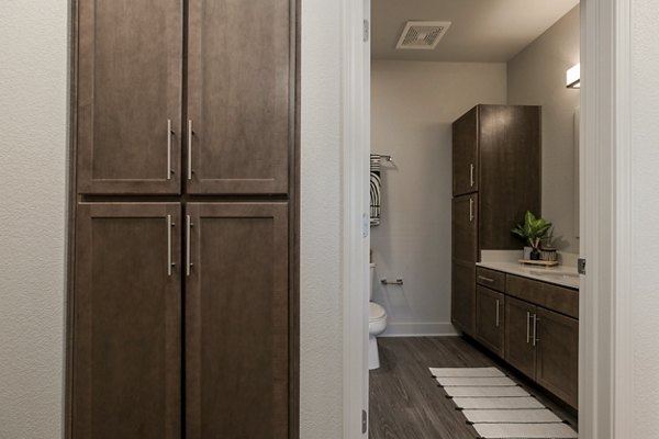 Contemporary hallway with elegant lighting and modern decor at The Avante Apartments