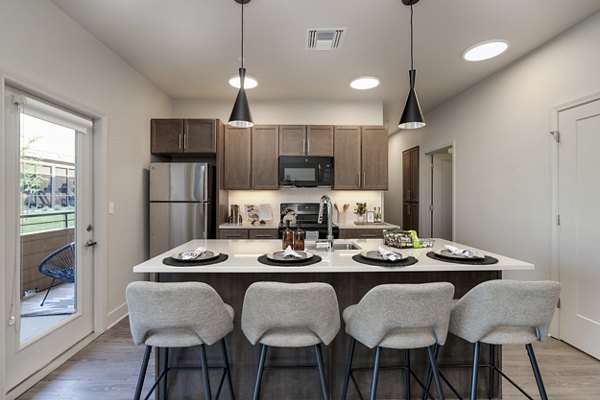 Modern kitchen with stainless steel appliances at The Avante Apartments, Greystar luxury community in an urban setting
