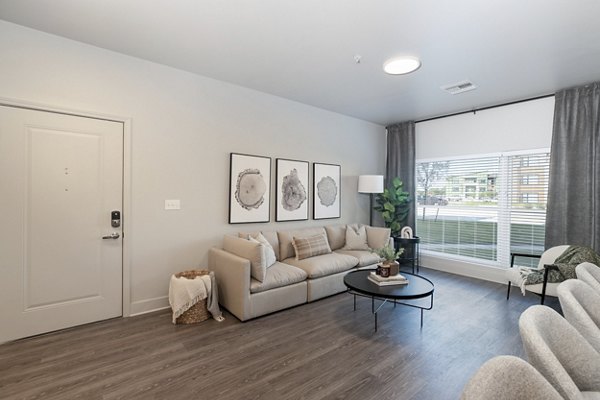 Spacious living room with modern decor in The Avante Apartments