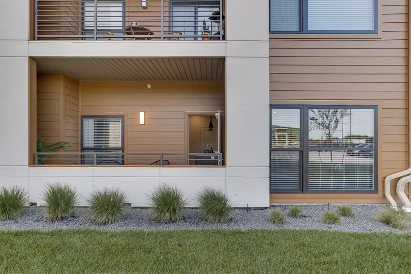 Spacious patio with modern furniture at The Avante Apartments, perfect for outdoor relaxation and gatherings in a luxury setting
