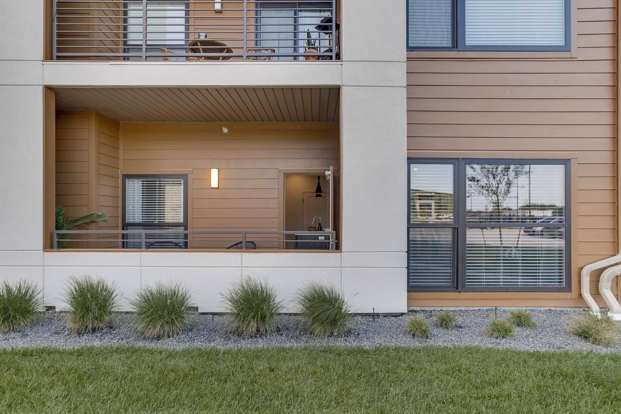 Spacious patio with modern furniture at The Avante Apartments, perfect for outdoor relaxation and gatherings in a luxury setting