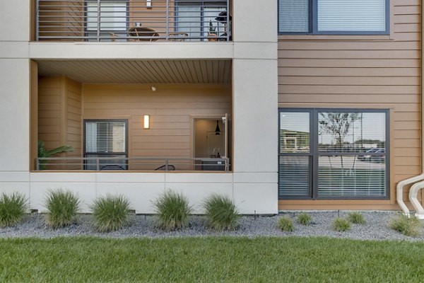 Spacious patio with modern furniture at The Avante Apartments, perfect for outdoor relaxation and gatherings in a luxury setting