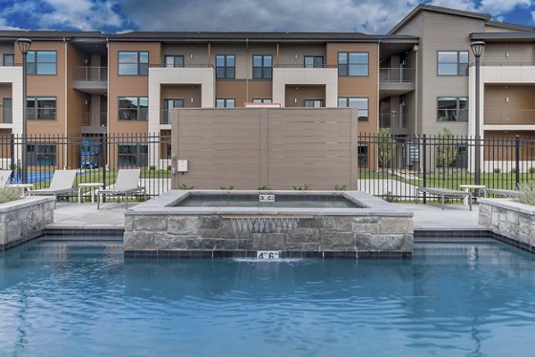 Modern poolside retreat at The Avante Apartments offering luxurious amenities and a sophisticated outdoor lounging area