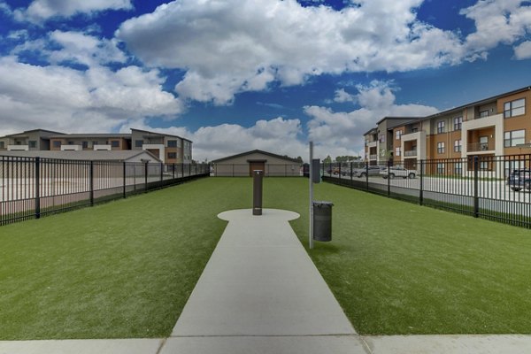 Well-maintained dog park with agility equipment at The Avante Apartments