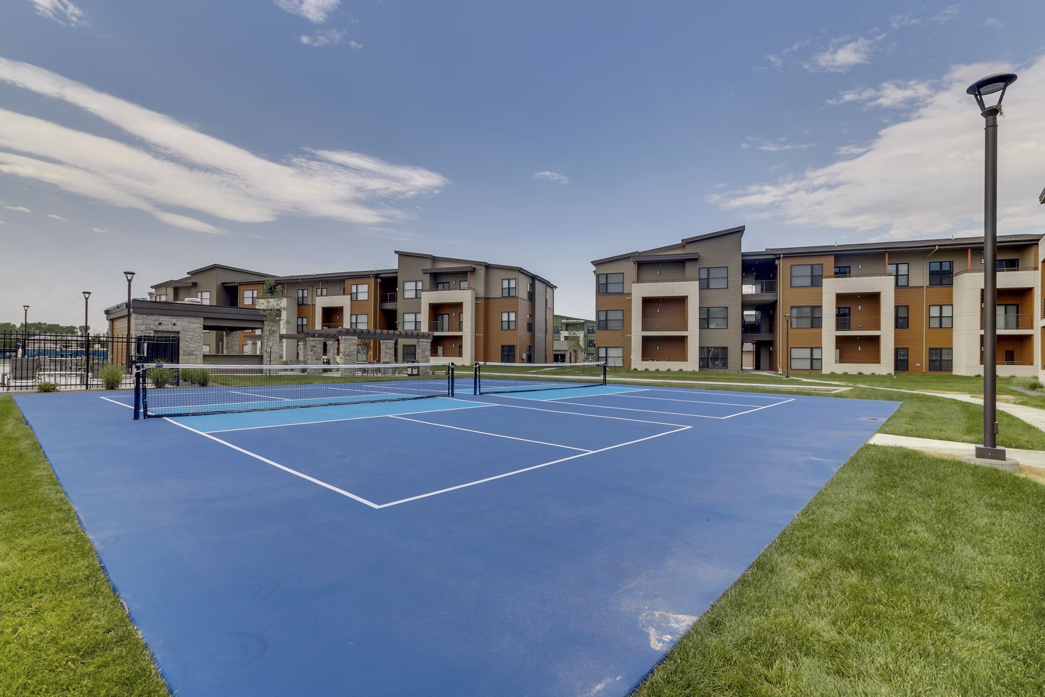 Outdoor sport court at The Avante Apartments in luxury community, ideal for basketball and tennis enthusiasts
