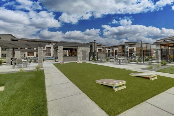 Courtyard with lush greenery and outdoor seating at The Avante Apartments, Greystar luxury residence