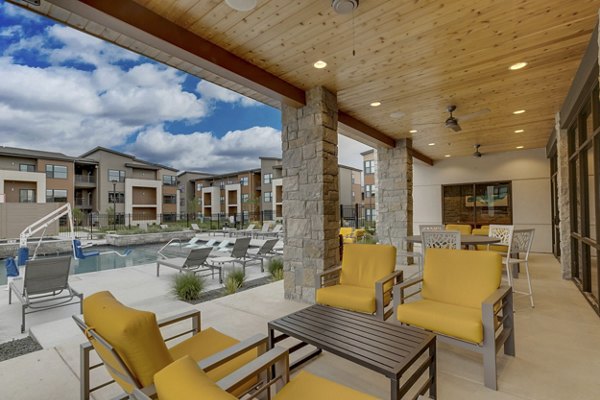 Spacious outdoor patio with modern seating at The Avante Apartments, perfect for relaxation and gatherings in a luxury setting