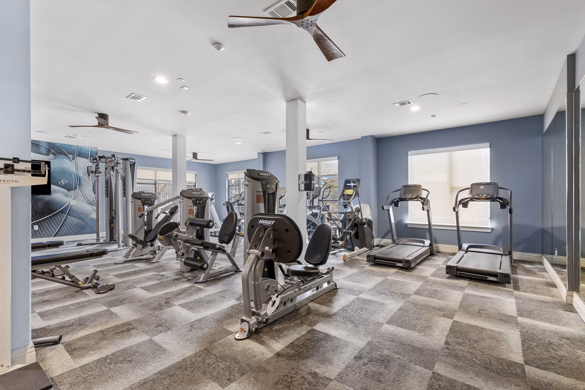 fitness center at The Briscoe Apartments 