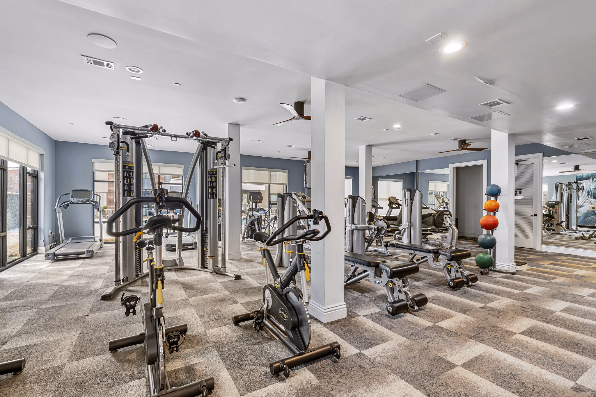 fitness center at The Briscoe Apartments 