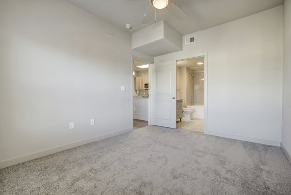 Cozy bedroom featuring modern design elements at Trillium Terrace Apartments