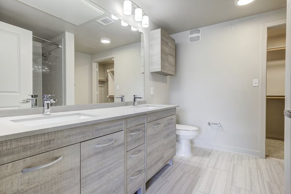 Trillium Terrace Apartments: Modern bathroom with sleek fixtures and marble countertops