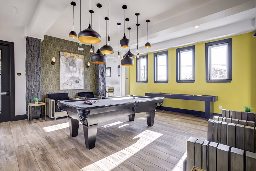 Clubhouse with modern design and plush seating at Trillium Terrace Apartments, offering luxury experiences for residents