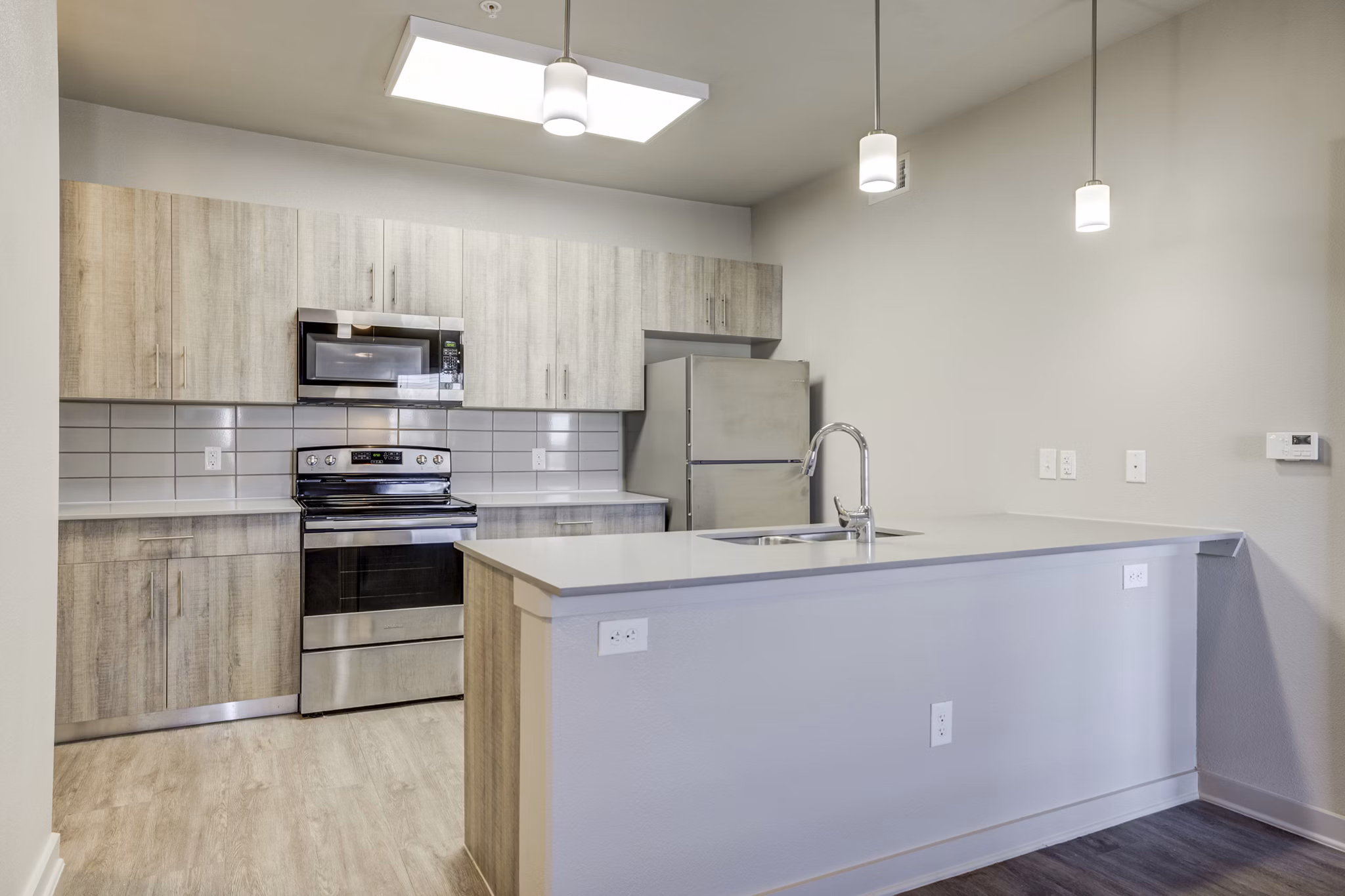 Trillium Terrace Apartments: Modern kitchen with sleek countertops and stainless steel appliances