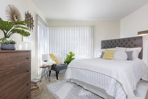 Cozy bedroom with modern decor at Coronado Apartments: luxury living by Greystar in prime city location