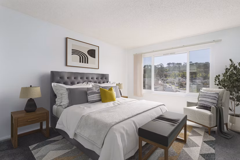 Spacious bedroom with modern furnishings at Coronado Apartments luxury community