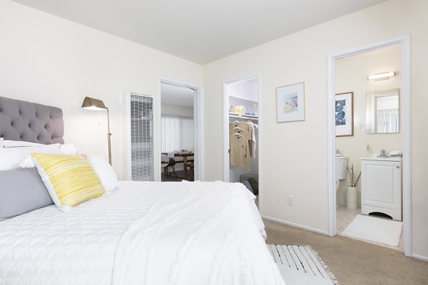 Spacious bedroom with modern furnishings at Coronado Apartments luxury community