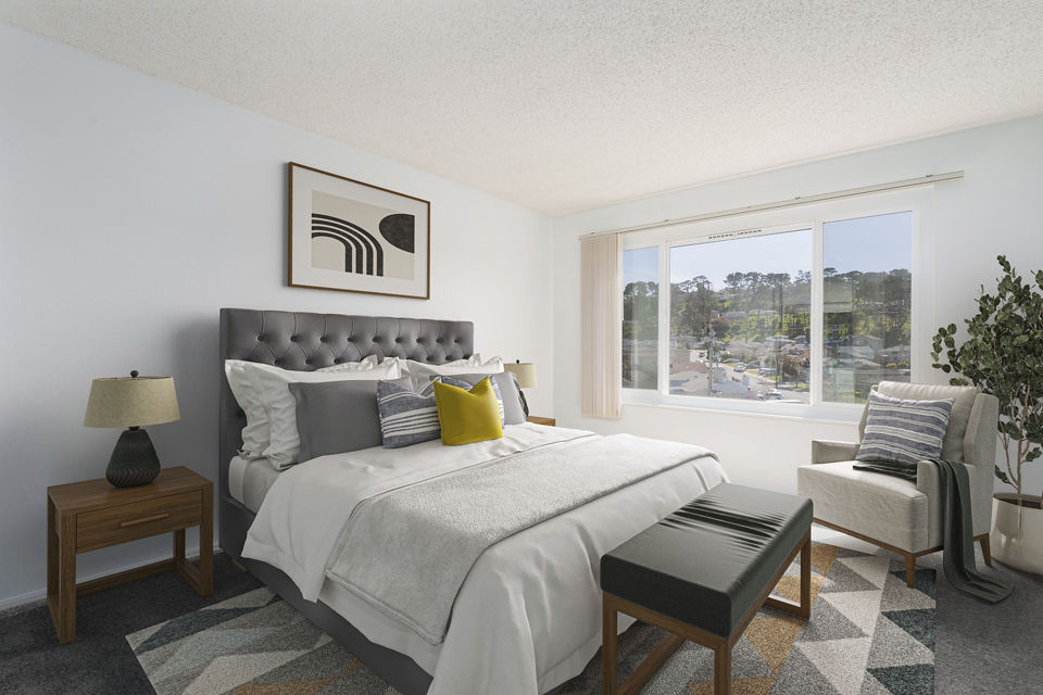 Spacious bedroom with modern furnishings at Coronado Apartments luxury community