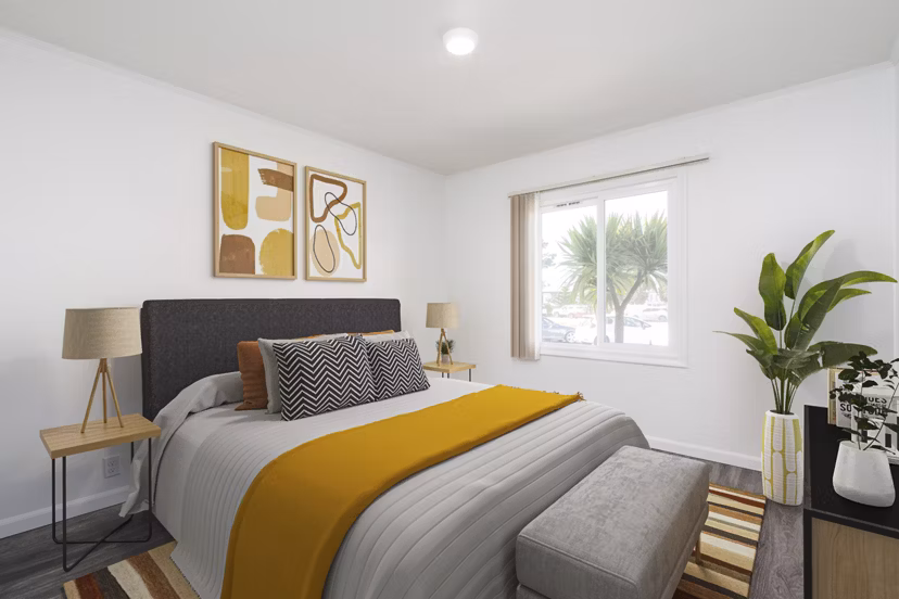 Bedroom with stylish decor and large windows at Coronado/Westlake Village Apartments, Greystar luxury apartments in a serene neighborhood