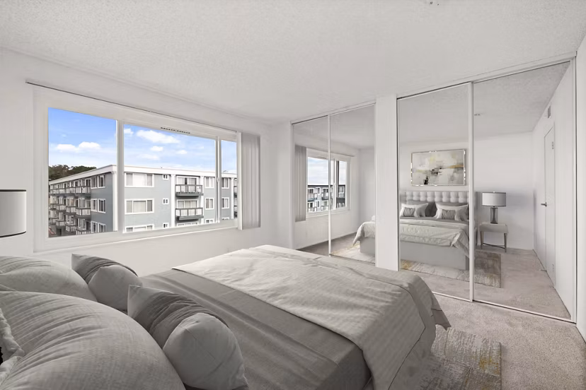 Bedroom featuring modern design and natural light at Coronado/Westlake Village Apartments