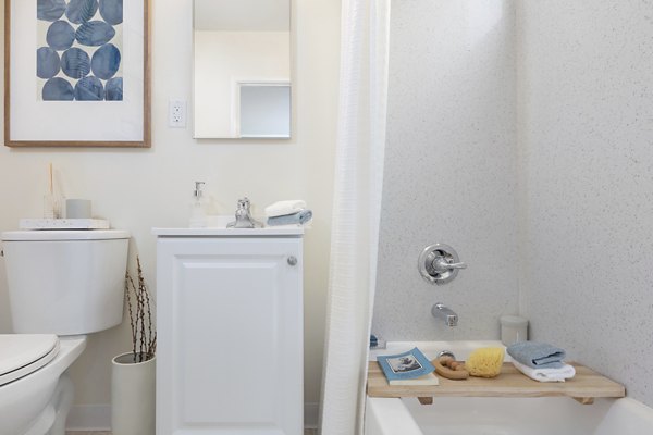 Modern bathroom featuring sleek fixtures and marble countertops in Coronado Apartments