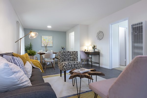 Modern living room with plush seating and stylish decor in Coronado Apartments