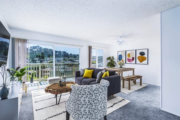 Cozy living room featuring plush seating and modern decor at Coronado Westlake Village Apartments luxury units