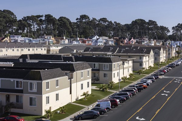 Ocean view from luxury apartment balcony at Coronado Apartments in scenic waterfront location