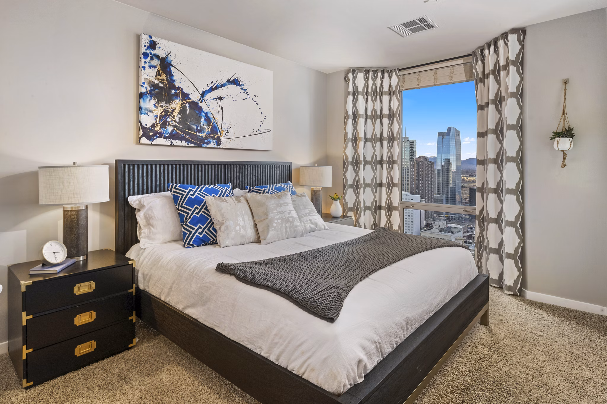 Cozy bedroom with modern decor at 1600 Glenarm Place Apartments