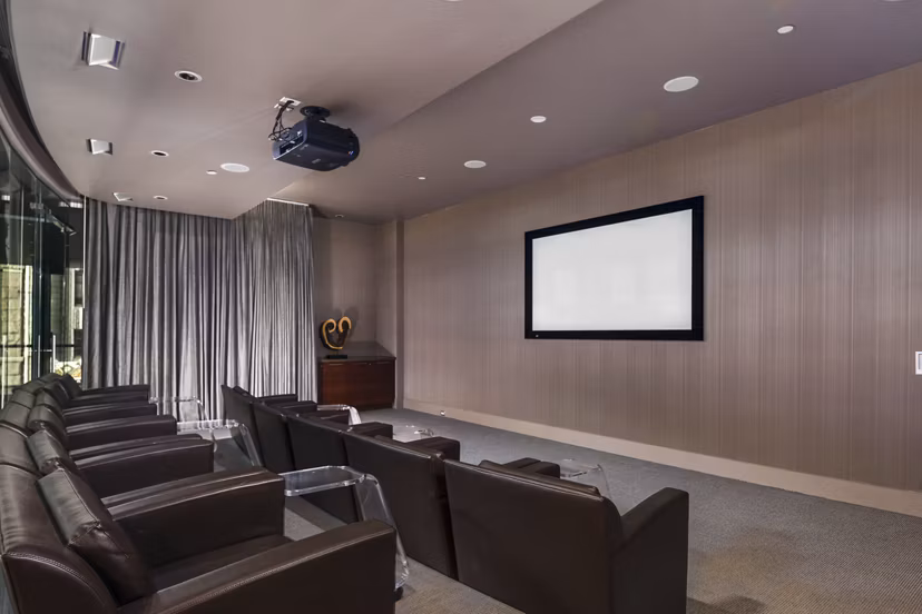 State-of-the-art theater featuring plush seating at 1600 Glenarm Place Apartments, Denver