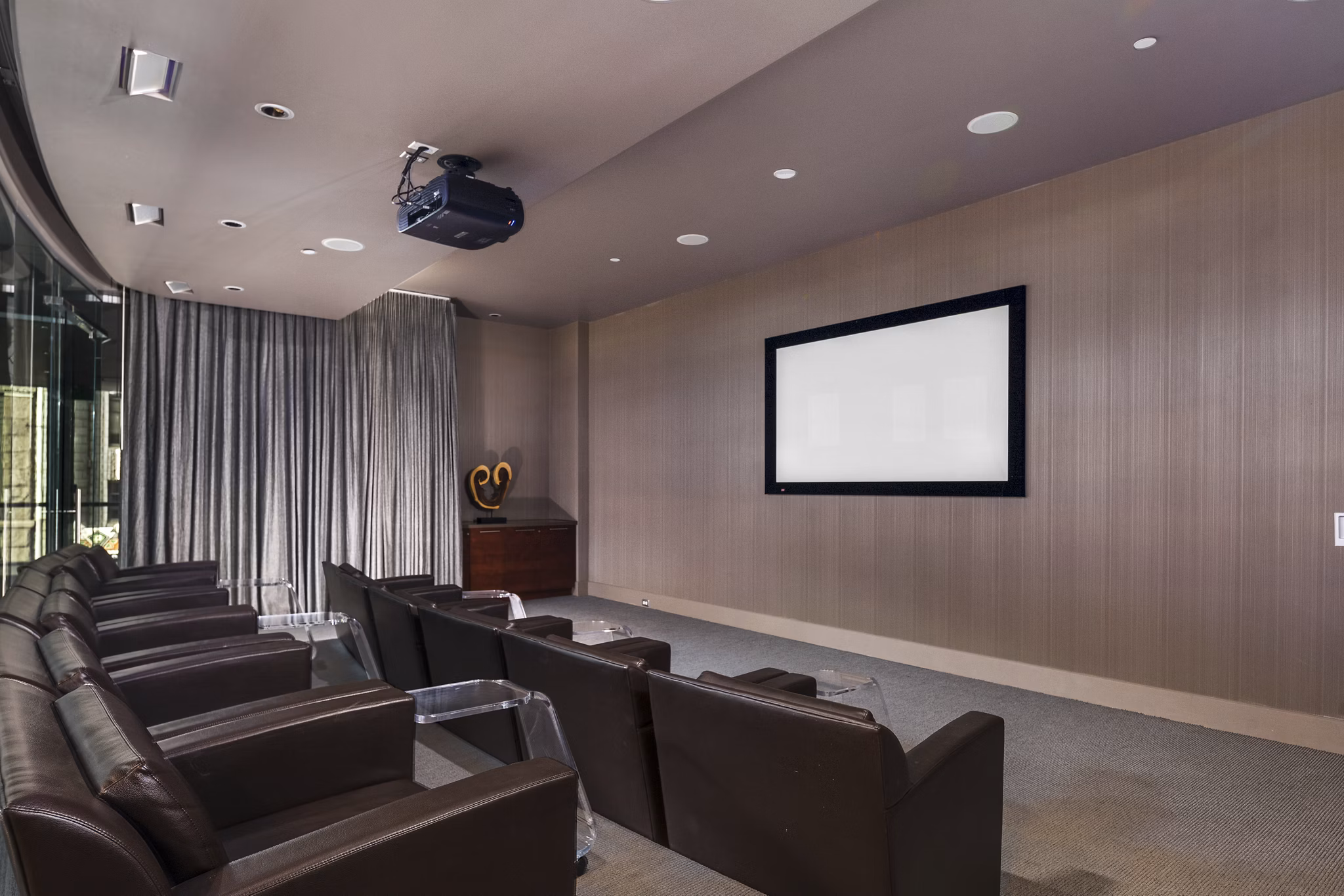 State-of-the-art theater featuring plush seating at 1600 Glenarm Place Apartments, Denver